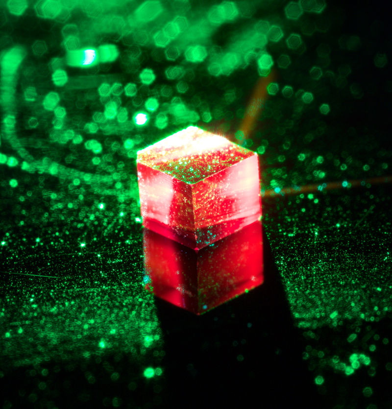 A fluorescing diamond with nitrogen vacancies.